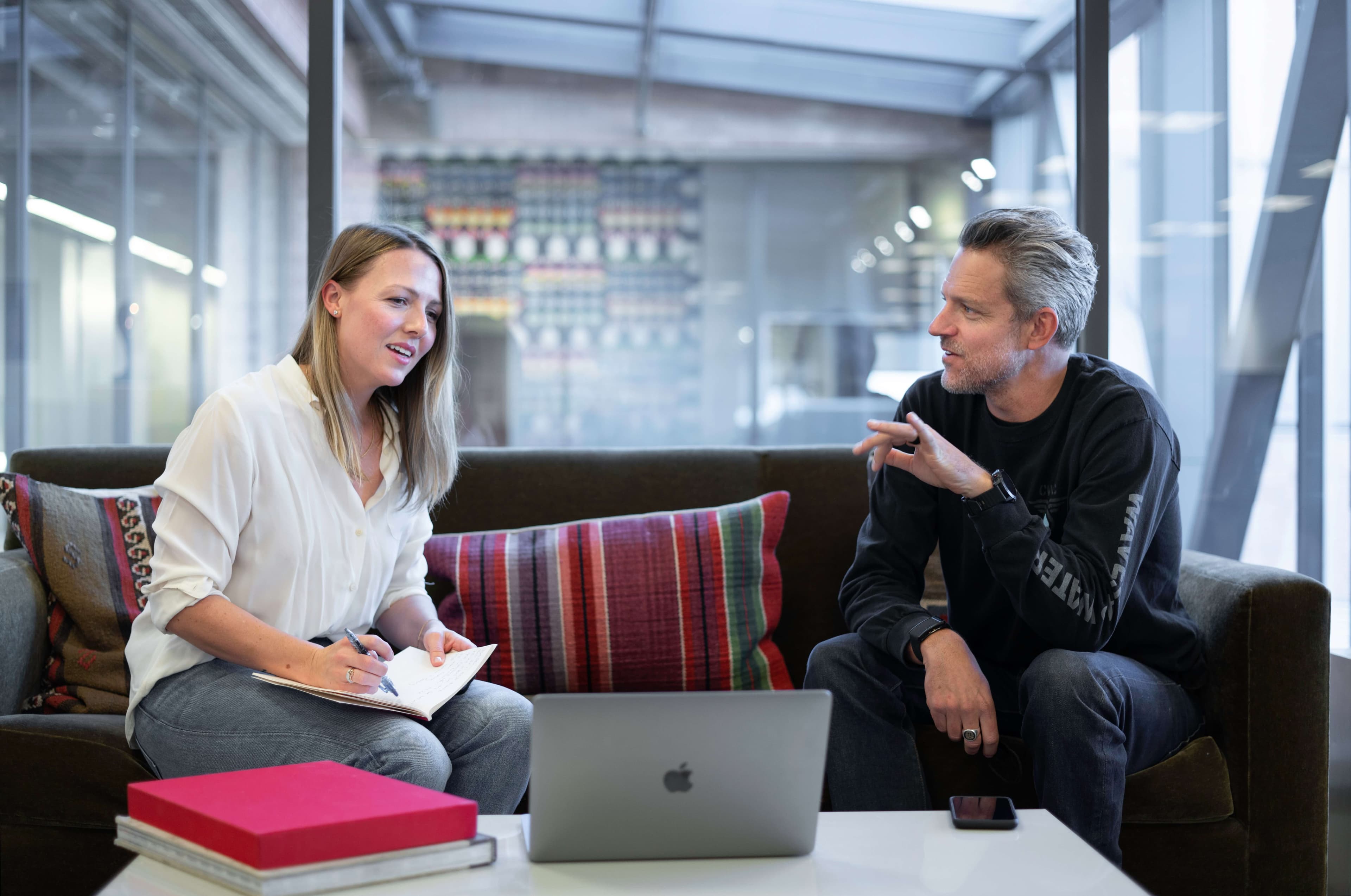 women mentor meeting with her male mentee in the workplace