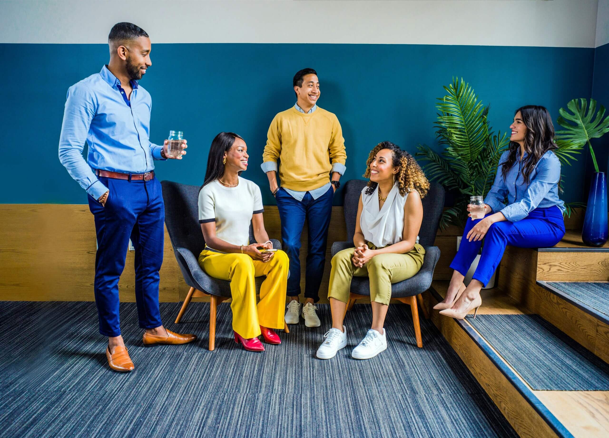 Employees discussing how strong mentorship training builds successful outcomes at work