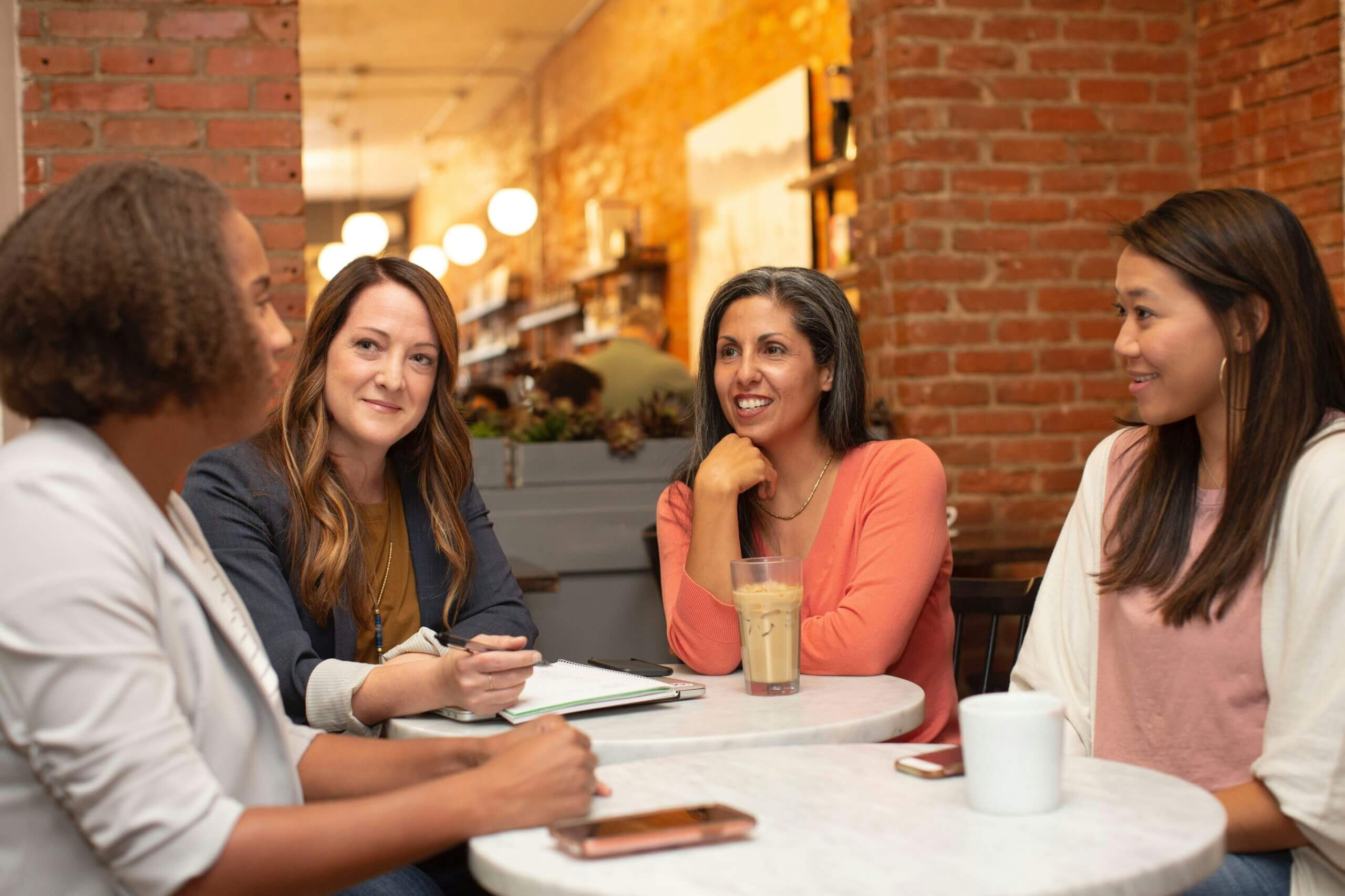 Employees discussing leadership challenges with women VPs