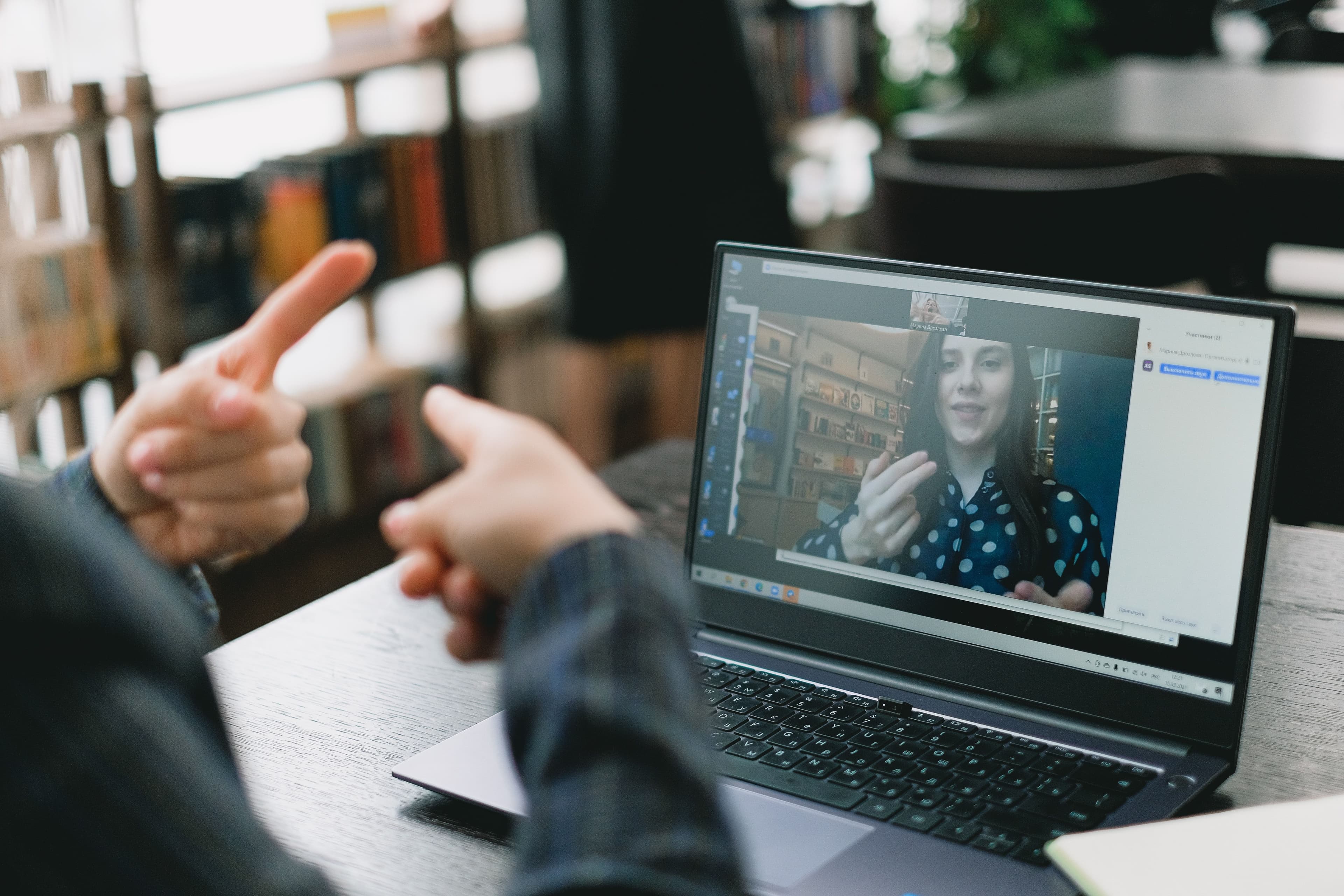 man and woman interact over a video call mentoring session